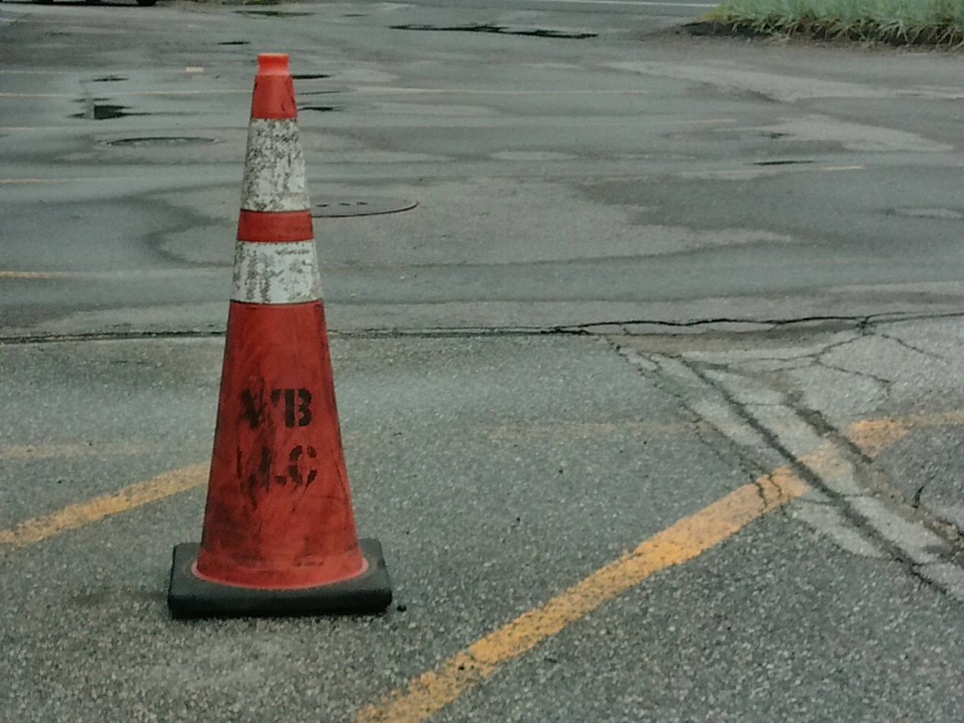 Crack sealing on an asphalt lot
